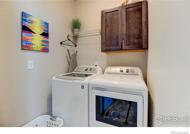 2449 Trio Falls Dr, Loveland, CO 80538 - clothes washing area featuring cabinet space and independent washer and dryer