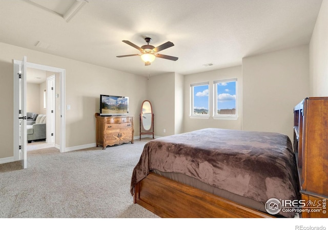 bedroom with carpet flooring, baseboards, visible vents, and ceiling fan