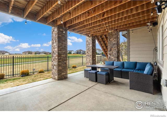 view of patio / terrace with a residential view, an outdoor hangout area, and a fenced backyard