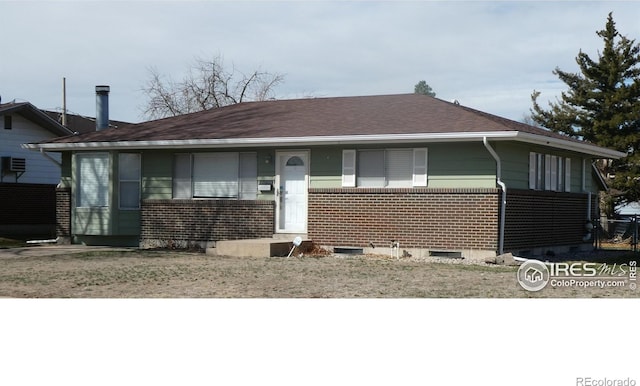 view of front of home with brick siding