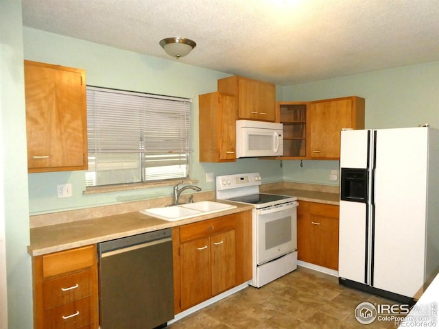 kitchen with open shelves, a sink, light countertops, white appliances, and brown cabinetry