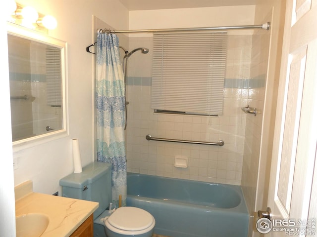 full bathroom featuring toilet, shower / bath combo with shower curtain, and vanity
