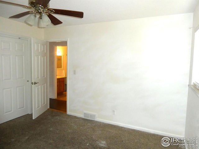 unfurnished bedroom featuring carpet, visible vents, baseboards, and ceiling fan