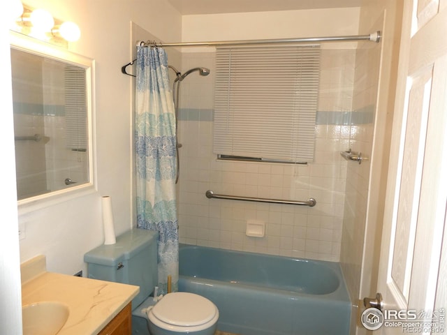 bathroom featuring toilet, shower / tub combo with curtain, and vanity