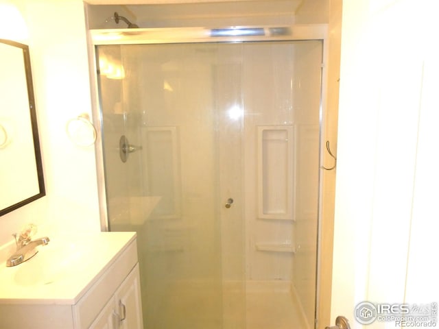 full bath featuring vanity and a stall shower