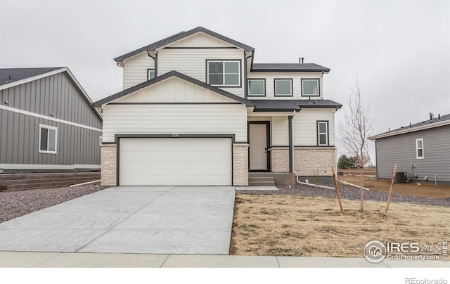 1219 105th Avenue Ct, Greeley, CO 80634 - view of front of home with entry steps, concrete driveway, brick siding, board and batten siding, and cooling unit