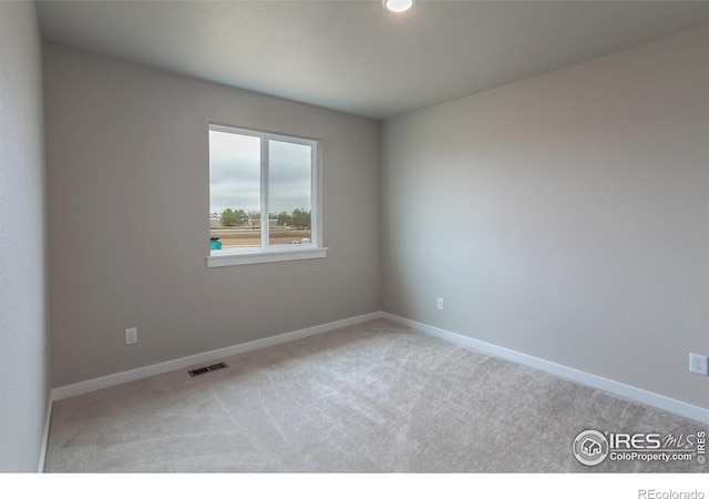 1219 105th Avenue Ct, Greeley, CO 80634 - carpeted empty room with baseboards and visible vents