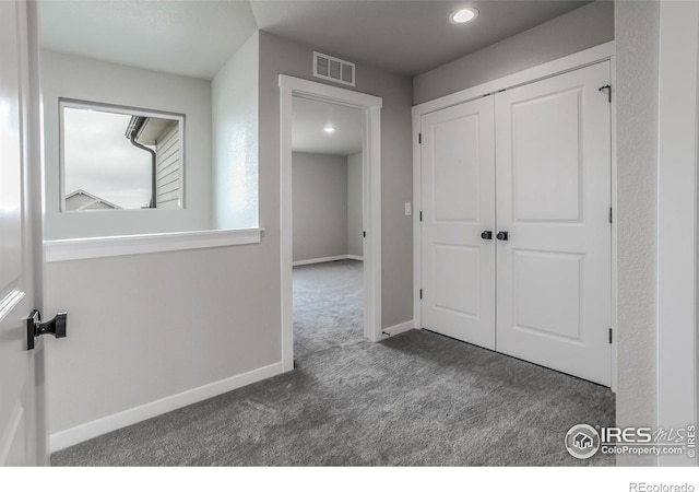 1219 105th Avenue Ct, Greeley, CO 80634 - corridor with baseboards, carpet floors, and visible vents