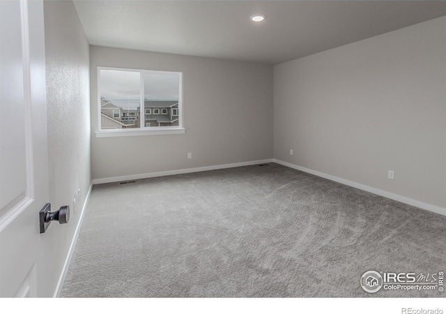 1219 105th Avenue Ct, Greeley, CO 80634 - unfurnished room with baseboards, carpet flooring, and recessed lighting