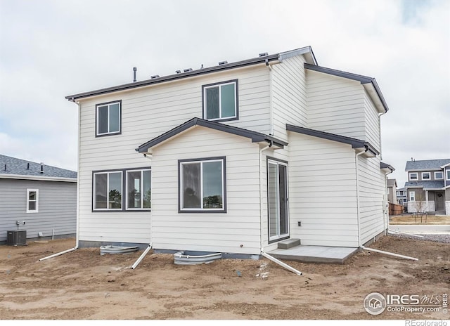 1219 105th Avenue Ct, Greeley, CO 80634 - rear view of house featuring central AC