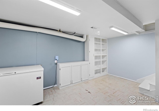 clothes washing area with visible vents