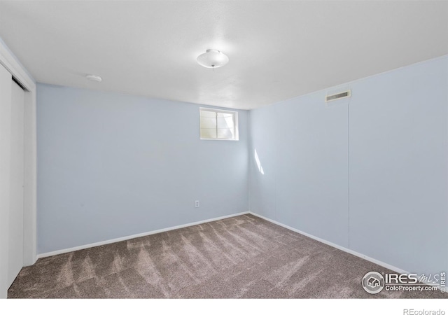 basement with carpet floors and visible vents