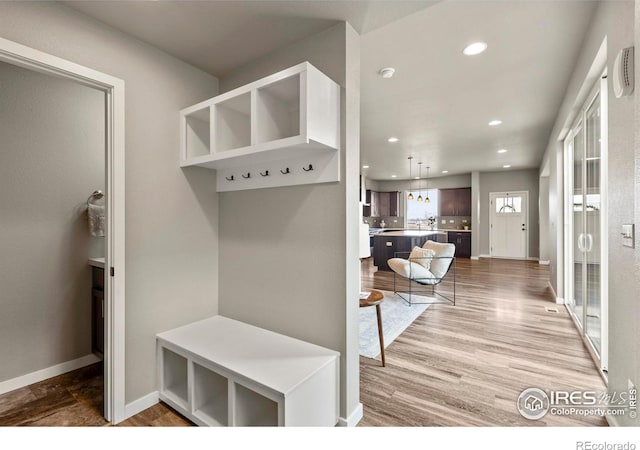 mudroom with baseboards, wood finished floors, and recessed lighting
