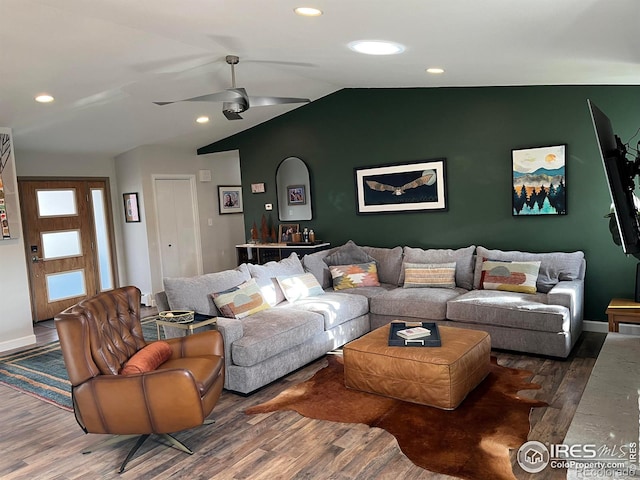 living room featuring wood finished floors, lofted ceiling, baseboards, ceiling fan, and recessed lighting