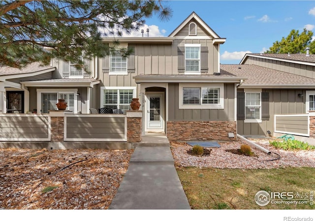 5125 Stetson Creek Ct Unit D, Fort Collins, CO 80528 - view of front facade featuring board and batten siding and stone siding