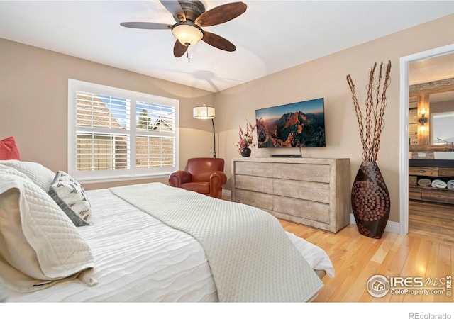 5125 Stetson Creek Ct Unit D, Fort Collins, CO 80528 - bedroom featuring light wood finished floors, ceiling fan, and baseboards