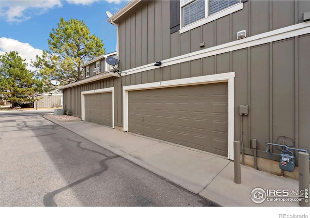 5125 Stetson Creek Ct Unit D, Fort Collins, CO 80528 - garage with central AC unit and driveway