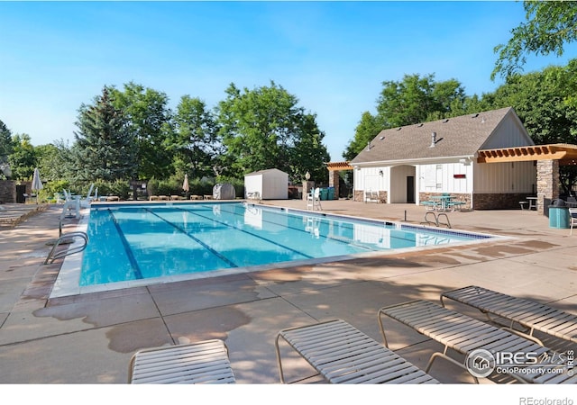 5125 Stetson Creek Ct Unit D, Fort Collins, CO 80528 - community pool with a patio area and a storage shed