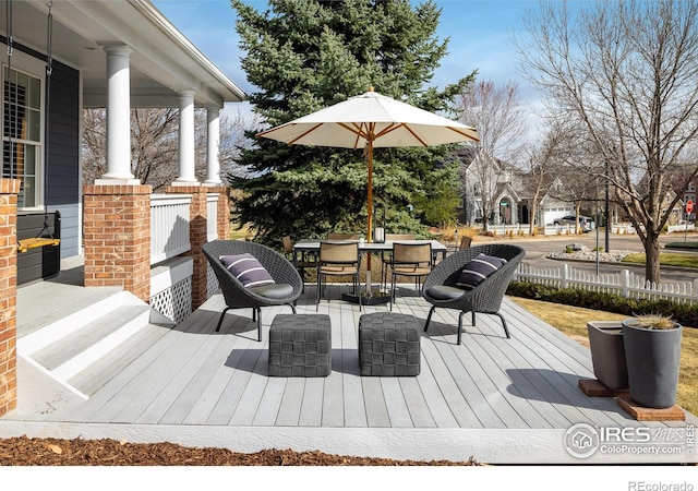301 Indian Peaks Trl W, Lafayette, CO 80026 - wooden terrace featuring covered porch and outdoor dining area