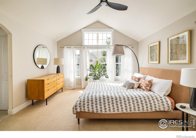 301 Indian Peaks Trl W, Lafayette, CO 80026 - carpeted bedroom featuring baseboards, arched walkways, ceiling fan, and vaulted ceiling