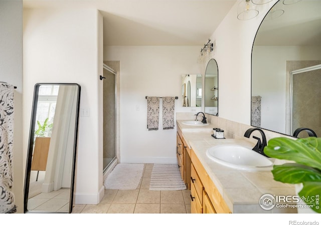 301 Indian Peaks Trl W, Lafayette, CO 80026 - bathroom with a sink, tile patterned flooring, a stall shower, and double vanity