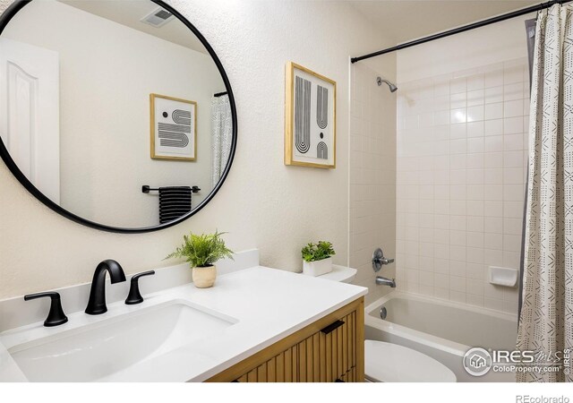 301 Indian Peaks Trl W, Lafayette, CO 80026 - full bath featuring toilet, shower / bathtub combination with curtain, and vanity