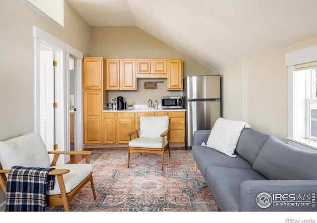 301 Indian Peaks Trl W, Lafayette, CO 80026 - living area featuring lofted ceiling