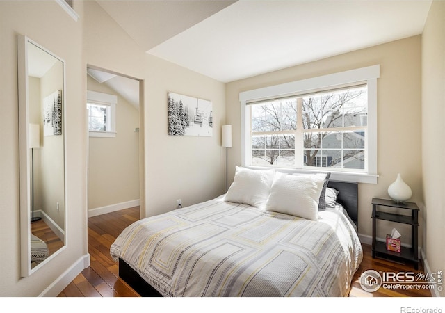 301 Indian Peaks Trl W, Lafayette, CO 80026 - bedroom with baseboards and wood finished floors