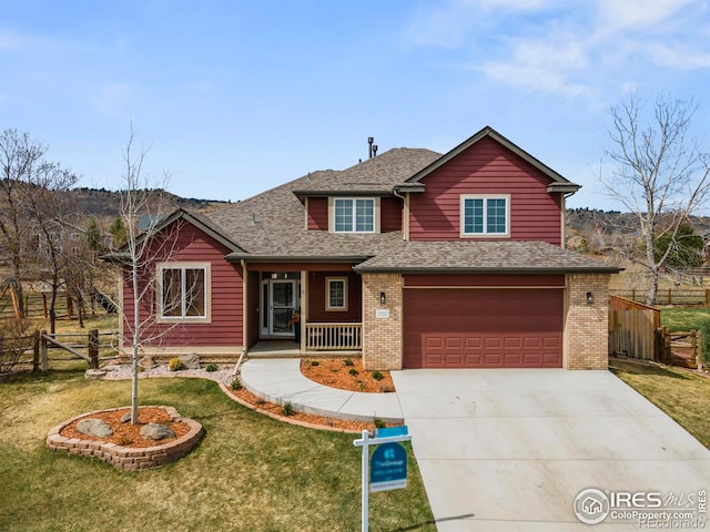 view of front of property with a garage, fence, concrete driveway, a front lawn, and roof with shingles