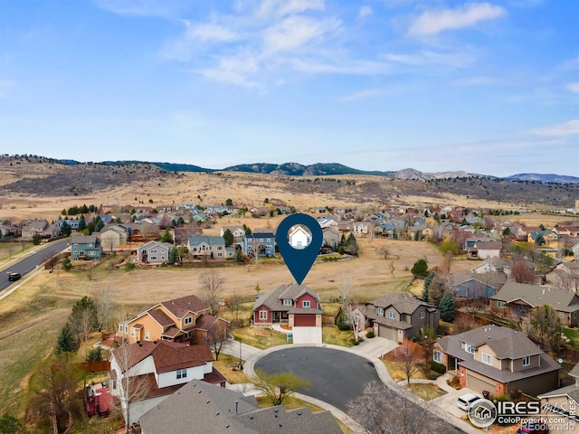 birds eye view of property with a residential view and a mountain view