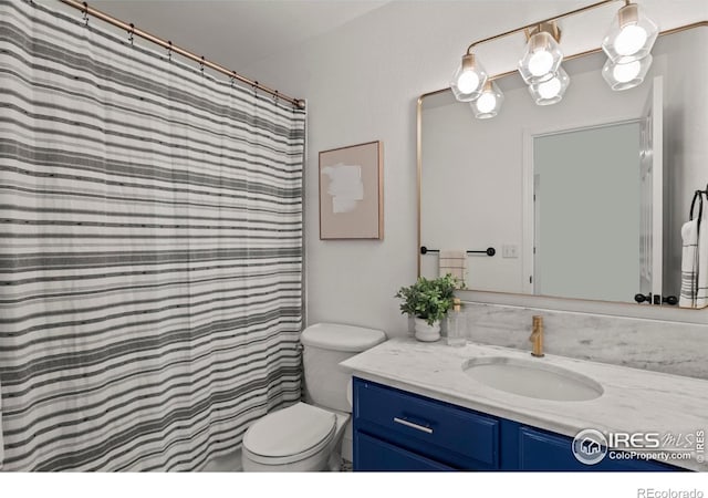 full bath with vanity and toilet