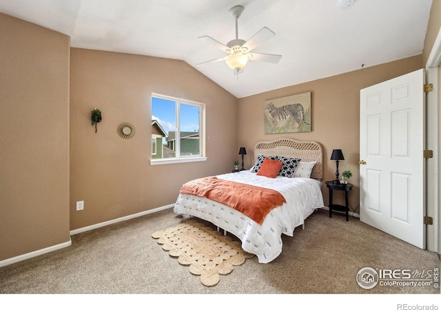 bedroom featuring baseboards, ceiling fan, carpet, and vaulted ceiling