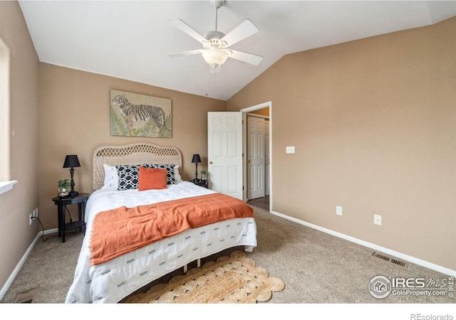 carpeted bedroom with ceiling fan, visible vents, baseboards, and lofted ceiling