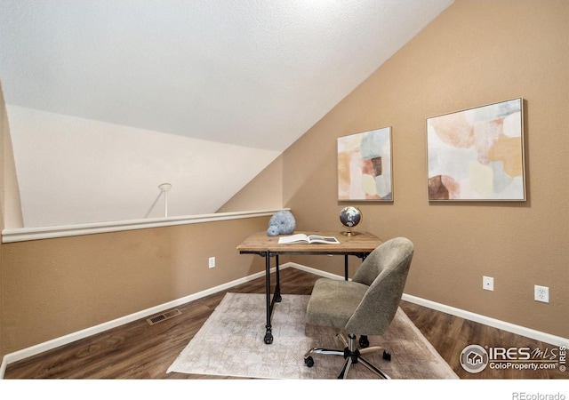 office featuring baseboards, wood finished floors, and lofted ceiling
