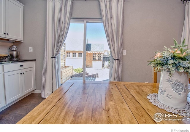 dining room with wood finished floors
