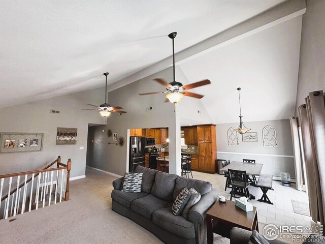 living room featuring vaulted ceiling, baseboards, visible vents, a ceiling fan, and light carpet