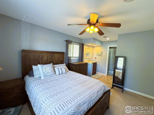 bedroom with baseboards, a textured ceiling, and a ceiling fan