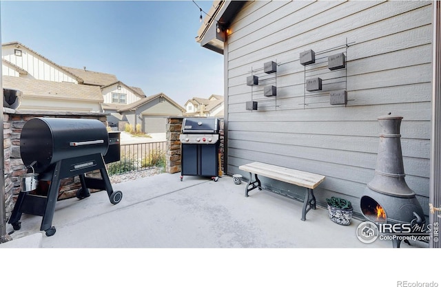 1563 Stoneseed St, Berthoud, CO 80513 - view of patio / terrace with area for grilling and fence