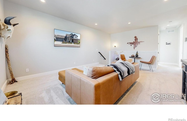 1563 Stoneseed St, Berthoud, CO 80513 - living room featuring light carpet, baseboards, visible vents, and recessed lighting