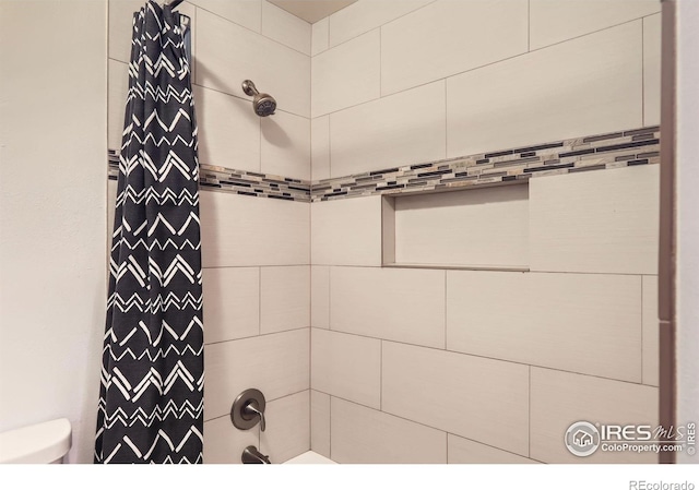 3790 Iris Ave Unit B, Boulder, CO 80301 - bathroom featuring toilet and shower / bath combo with shower curtain