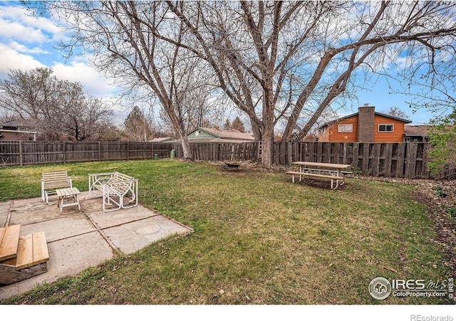 view of yard with a fenced backyard and a patio
