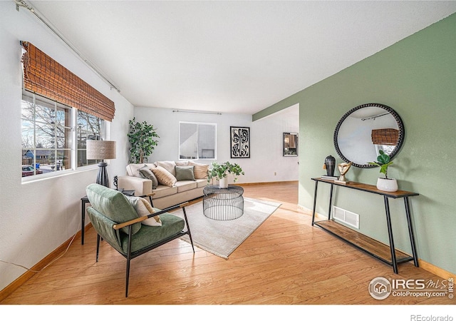 584 Sunwood Dr, Loveland, CO 80538 - living room with baseboards, visible vents, and wood finished floors