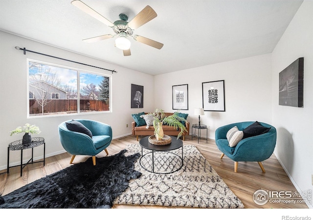 584 Sunwood Dr, Loveland, CO 80538 - living area featuring baseboards, ceiling fan, and wood finished floors