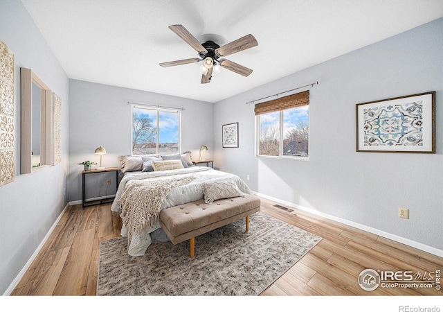 584 Sunwood Dr, Loveland, CO 80538 - bedroom featuring baseboards, visible vents, a ceiling fan, and wood finished floors