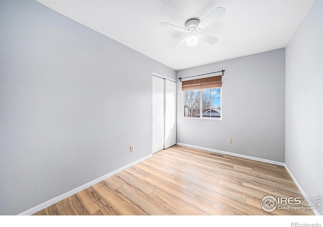 584 Sunwood Dr, Loveland, CO 80538 - unfurnished room with baseboards, visible vents, wood finished floors, and a ceiling fan
