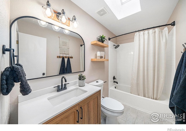 584 Sunwood Dr, Loveland, CO 80538 - full bath with toilet, vanity, a skylight, visible vents, and shower / bath combination with curtain