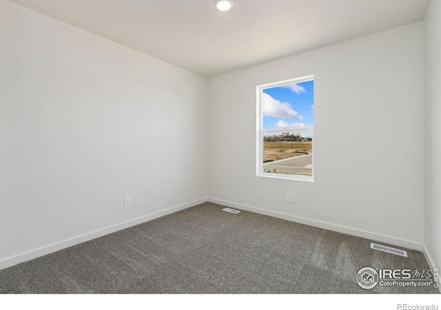 7153 Feather Reed Dr, Wellington, CO 80549 - unfurnished room with baseboards, visible vents, and dark colored carpet