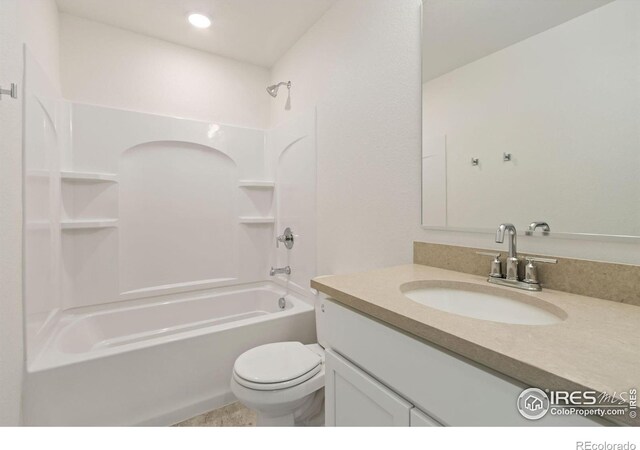 7153 Feather Reed Dr, Wellington, CO 80549 - bathroom with toilet, vanity, washtub / shower combination, and recessed lighting