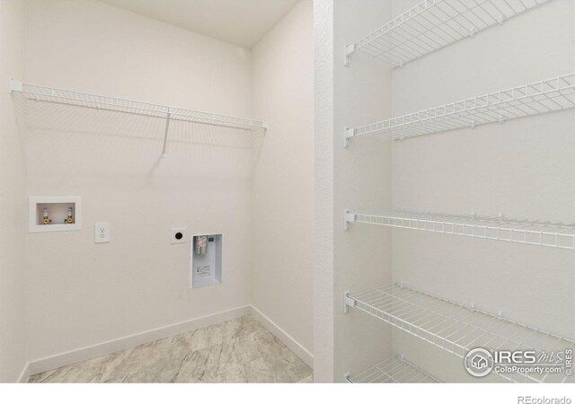 7153 Feather Reed Dr, Wellington, CO 80549 - laundry room featuring baseboards, laundry area, hookup for an electric dryer, and hookup for a washing machine