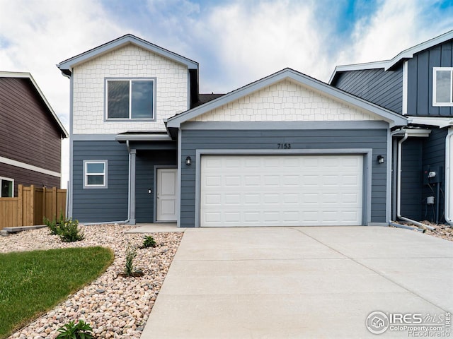 7153 Feather Reed Dr, Wellington, CO 80549 - view of front of house with concrete driveway and a garage